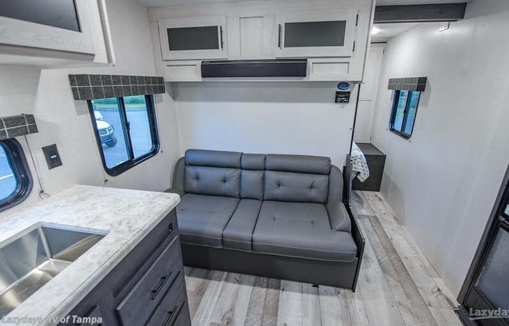 Couch that folds into bed. Speaker above the couch!