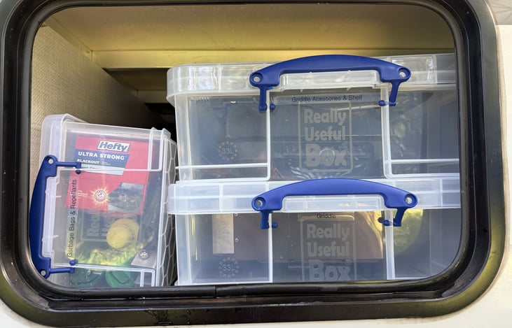Organized individual storage for griddle, griddle accessories, and misc supplies.