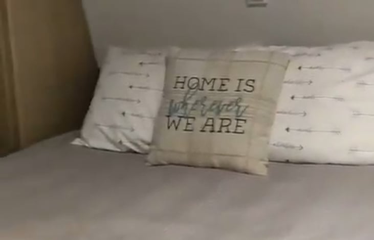 Master bedroom with dual nightstands and closets.