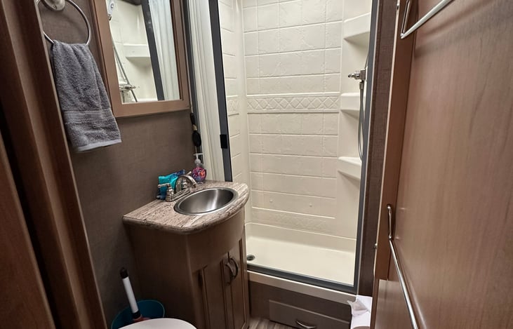 Stand up shower, bathroom sink, and toilet. Hot water heater works extremely well.