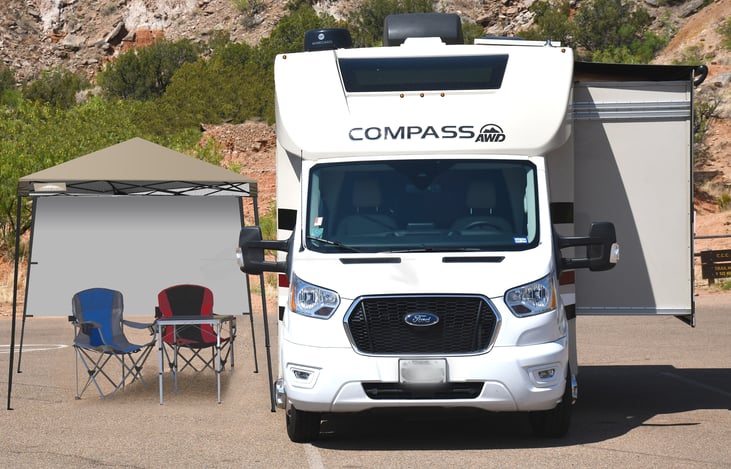 With slide & portable canopy. Includes table & chairs (up to 4 chairs) & gas grill.