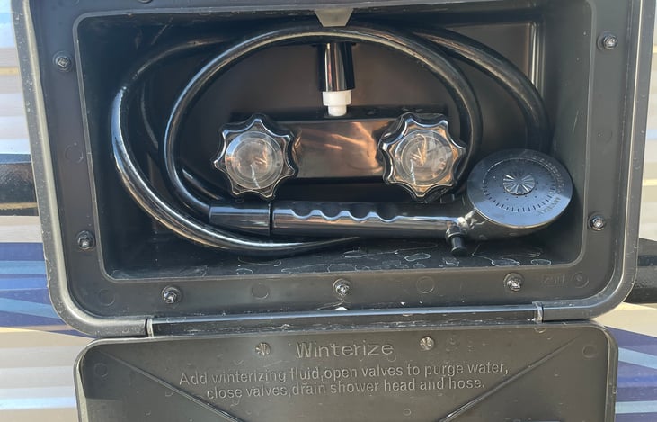 Outdoor shower. Very helpful for muddy paws/feet.