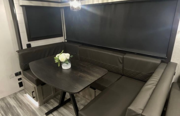 Dinette that converts into bed. Pillows and blankets provided.