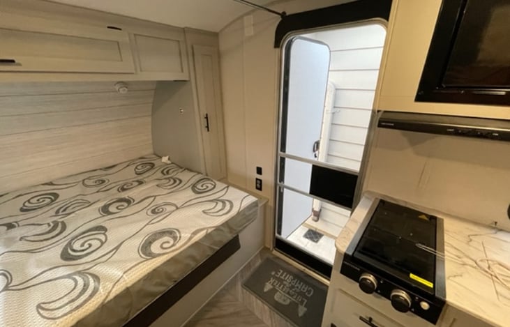 Main entry with screen door. Main door easy to lock from bed.