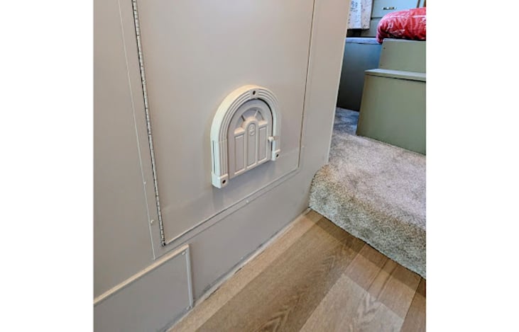 Cat door into shower for litter box