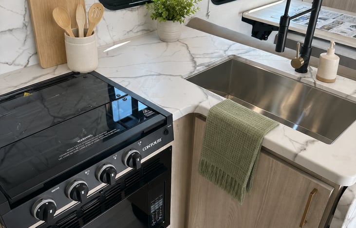 A thoughtfully stocked kitchen with generous counter space and everything you need to prepare meals on the road.