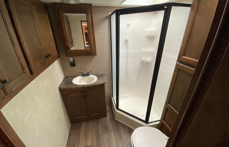 Bathroom is large with storage area