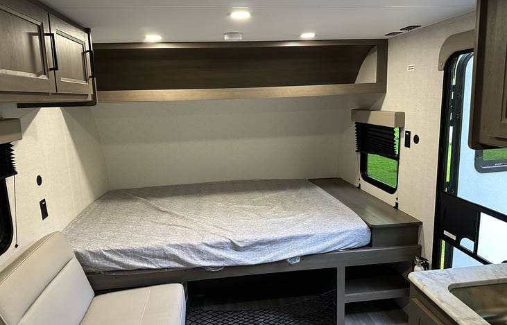 Queen Sized Bed with plenty of storage above and below.