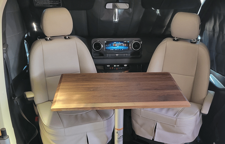 Cockpit chairs rotate for additional seating.  Alternate location for dining table is shown.