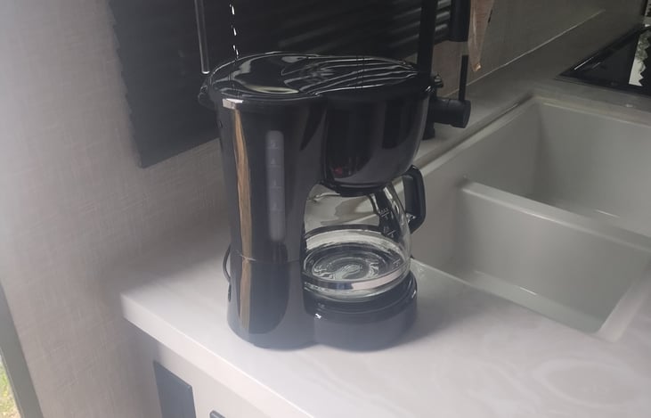 Coffee maker included for easy mornings.