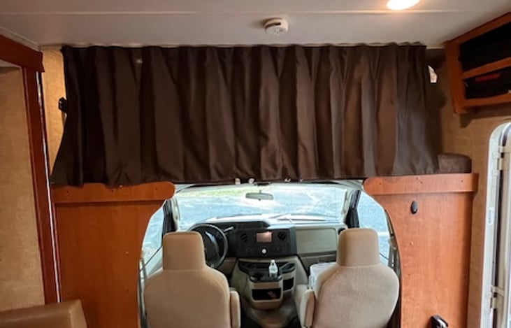 A privacy curtain on the overhead bunk.