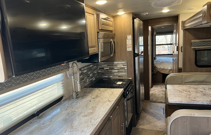 Picture taken from the front of Motor Home towards the rear and the private bedroom with King sized bed.