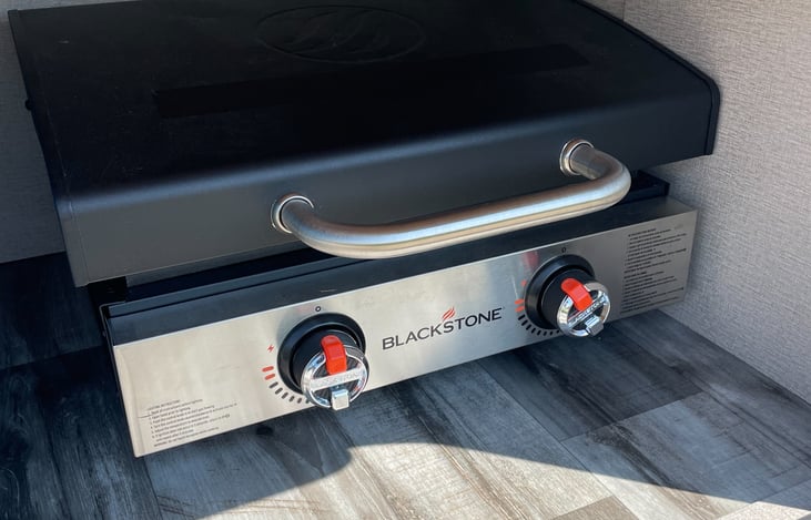 22 inch Blackstone table-top griddle. Uses 16 oz. propane cylinder. 
**NOT provided.
**1 small tank will be available at a $10 additional charge if used.