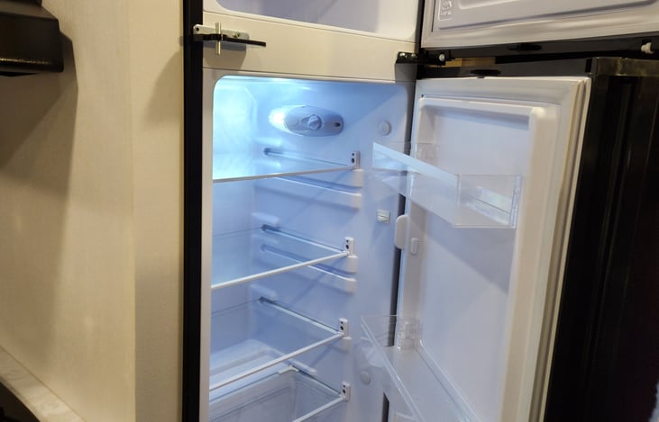 spacious refrigerator runs on shore power or battery.