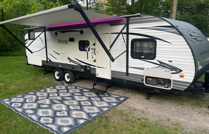 Comes with 9 by 12 mat for the ground. the awning is Powered