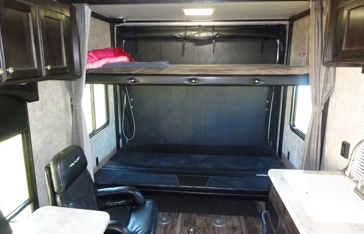 Bunk sleeping with the electric Happijack bed down with couch turned out as a bed