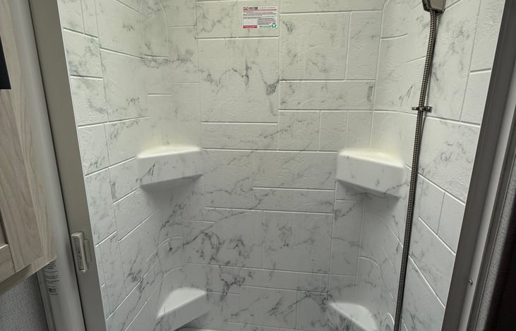 Shower area. It has a small tub also for the littles to take a bath.