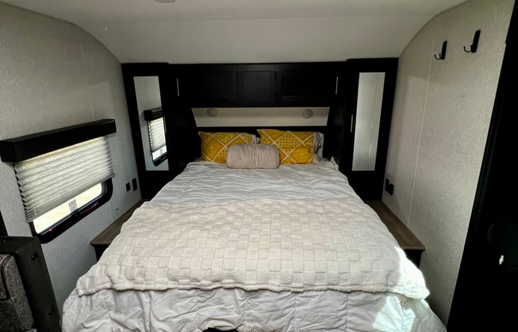 Queen bed with 2 closets on either side. Bed can also be converted to a love seat.