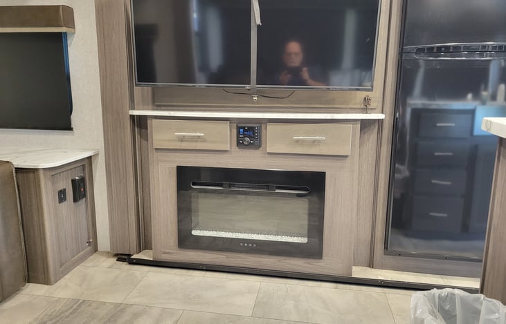 fireplace and stereo system with 52' inch tv. Stereo also has bluetooth capability