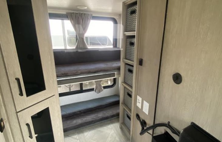 Hidden Bunkbeds behind a secret door behind the fireplace.