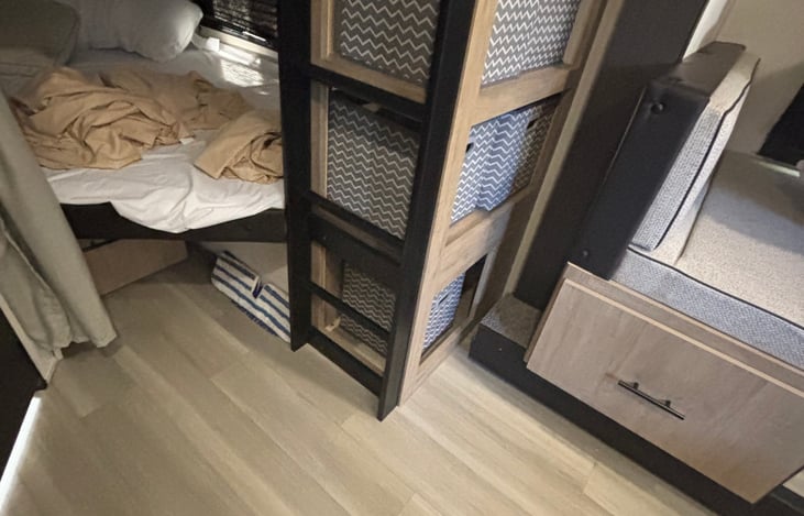 ladder to upper bunk and storage