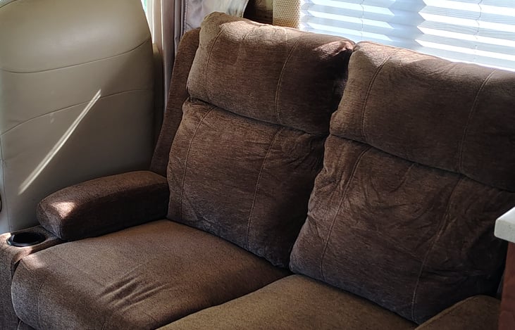 new dual recliner loveseat to allow seating for 10