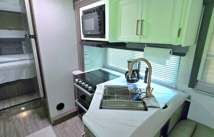 All the appliances and utensils you need to prepare a meal inside.