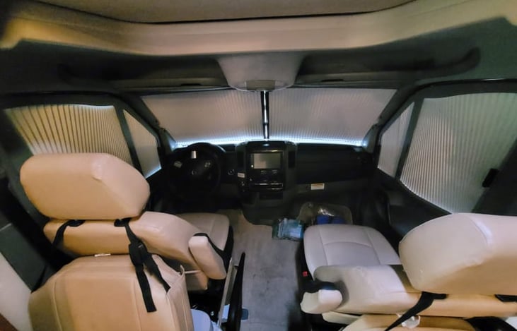 Drivers Area with privacy shades drawn.