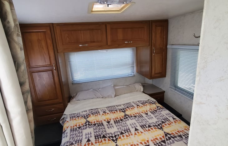 Back bedroom Queen size- Extra comforters and pillows under bed