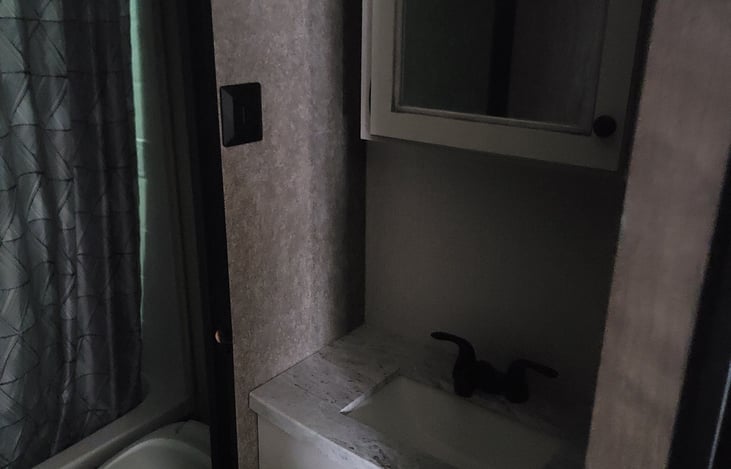 Shower/Tub Combo inside / Sink outside the door