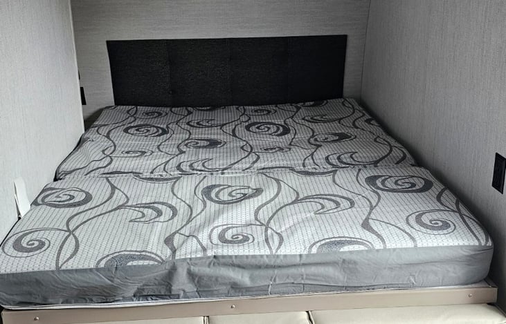 Comfortable queen-style sleeping area up front, converts to a couch for daytime use.