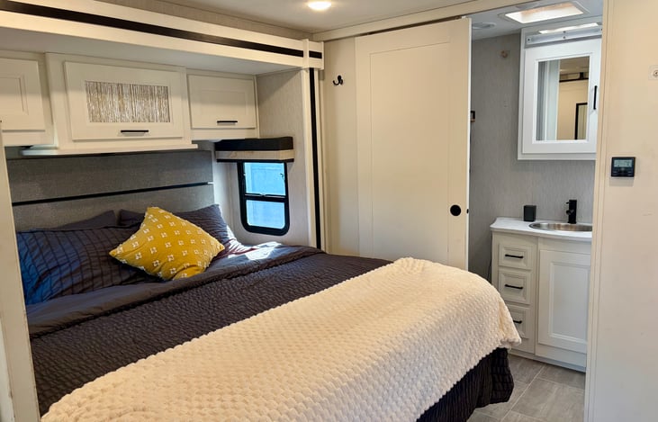 Master bedroom with king bed and door with lock to main area