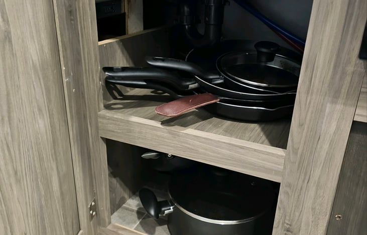 Under kitchen sink storage with all the pots and pan sizes you might need.