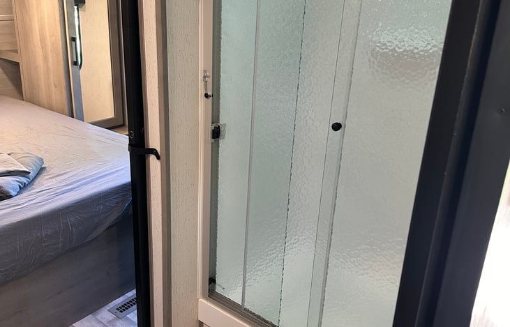 Shower with sliding doors.