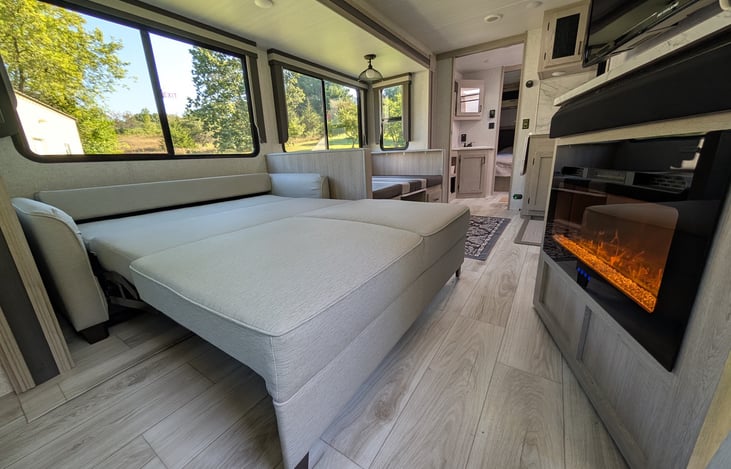 The convertible couch opens to a comfortable double bed that fits two adults.