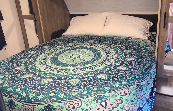 Master bedroom with upgraded 10" queen mattress.