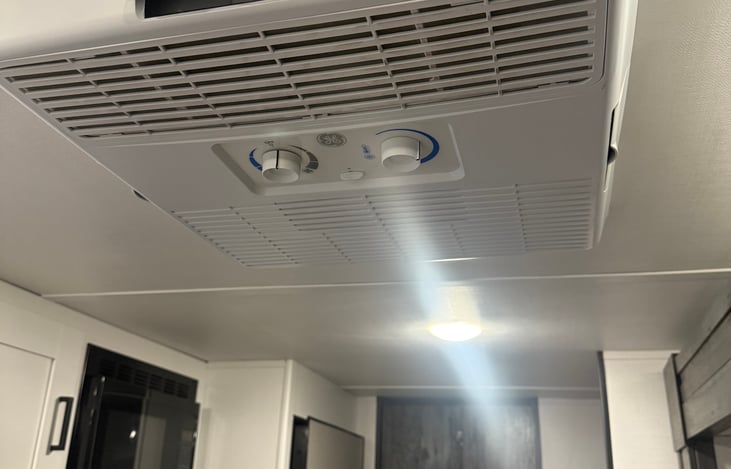 Roof-mounted 13,500 BTU ducted or non-ducted A/C unit - powered by either shore power (electric hookup) or a generator when boondocking.