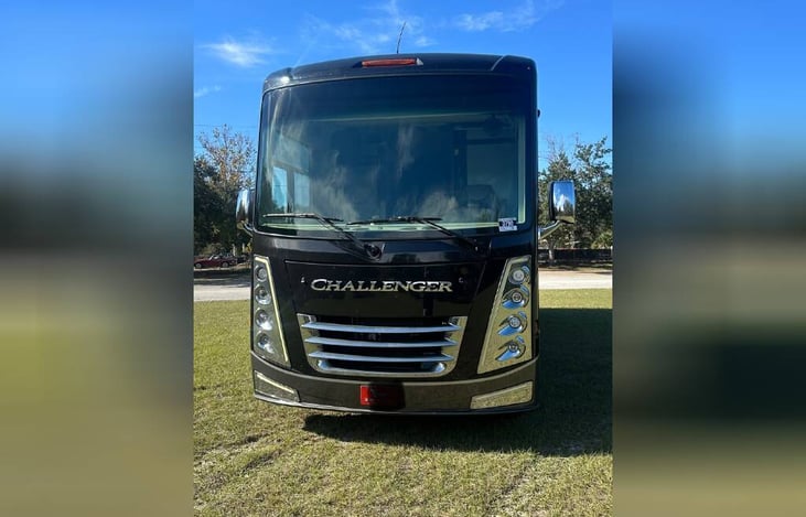 Super large front window. Each window in the coach has blackout blinds and screens.