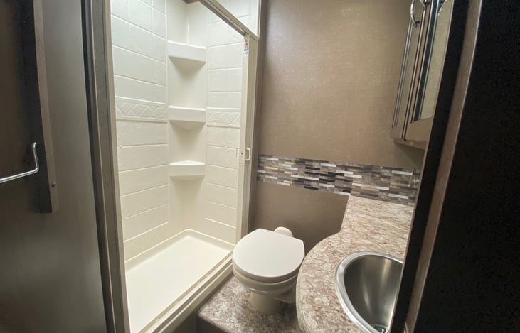 Super spacious bathroom, large shower where you can stand up easily and have elbow space too : )