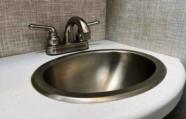 Close up of bathroom sink and countertop.