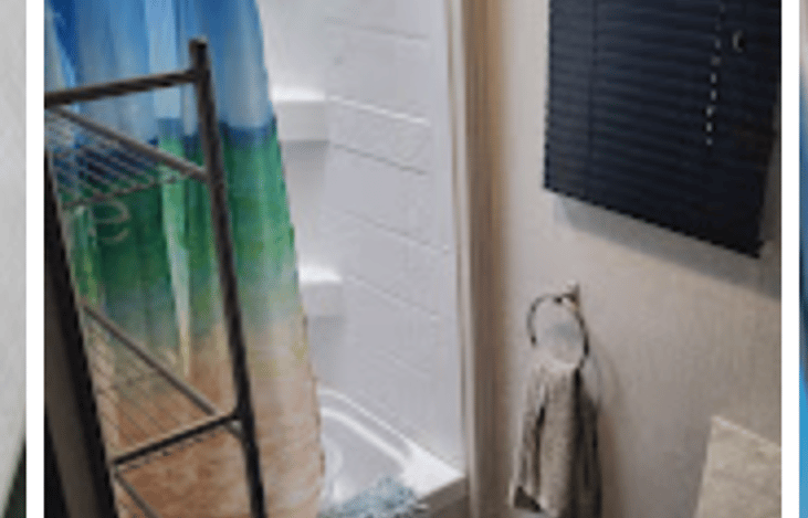 Fully equipped bathroom with small shower/tub combo.