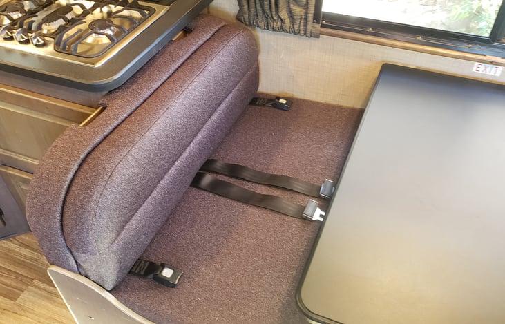 Dinette, has 4 seat belts. This area is perfect if you need to lookup information on your computer!