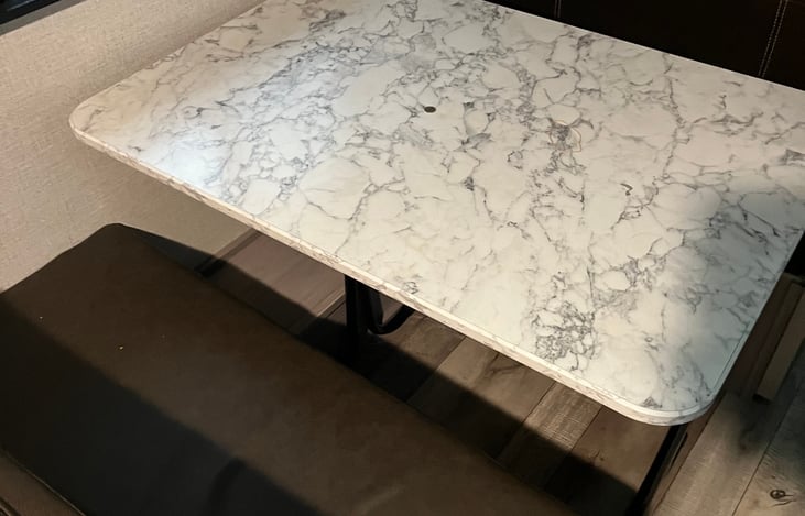 Kitchen table that can drop and be used as a bed.