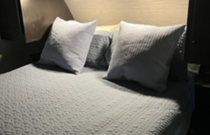 Queen size bed with 3" memory foam mattress topper.