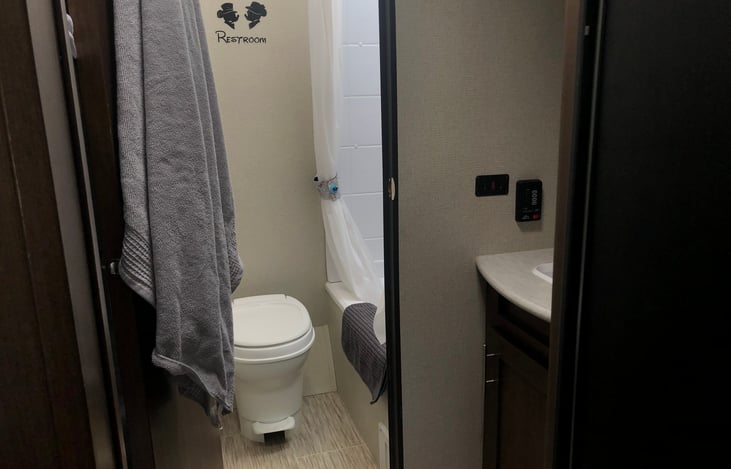 Sink and vanity located outside the bathroom