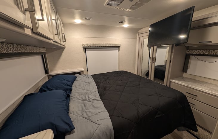 The Adventure Wagon - Queen Bed + In-Bed Entertainment Setup.