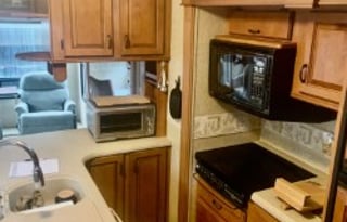 A 5th wheel travel trailer suited for 2 people