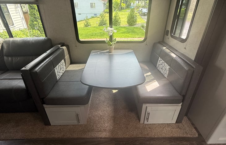 This dinette can sit up to apx 6 people depending on everyone's size. It also folds down into a little bed for one of your little campers.