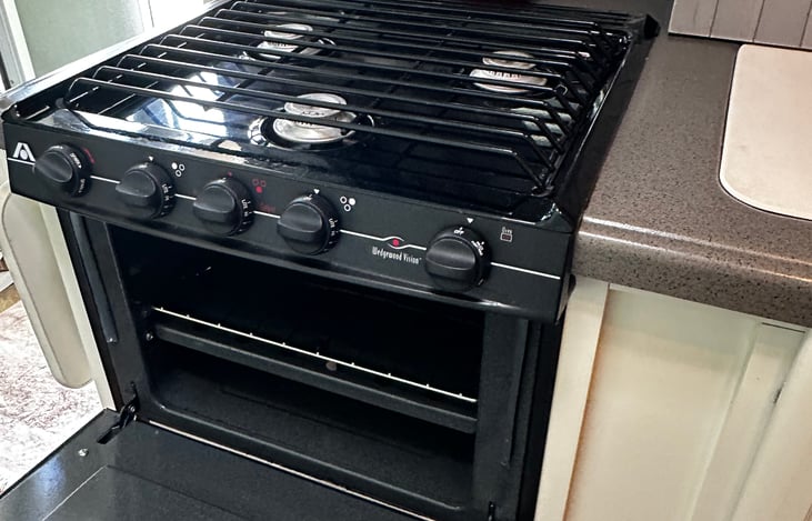 Three burner gas stove with oven.