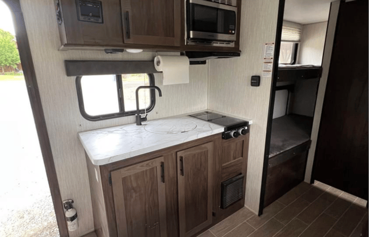 Sink and store, microwave works when plugged into power.